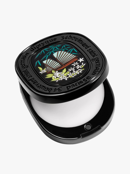 Diptyque Solid Perfume black compact of solid perfume on light gray background